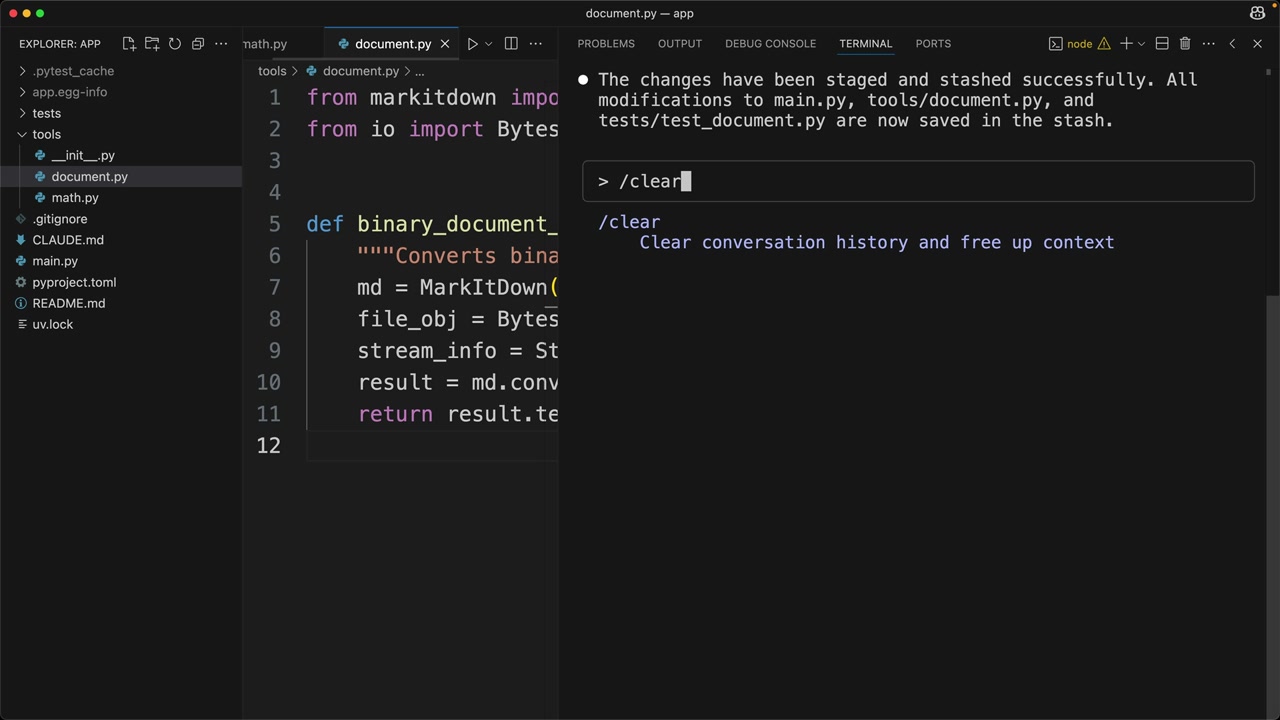 Claude Code terminal in VS Code with /clear typed, its help reading "Clear conversation history and free up context".