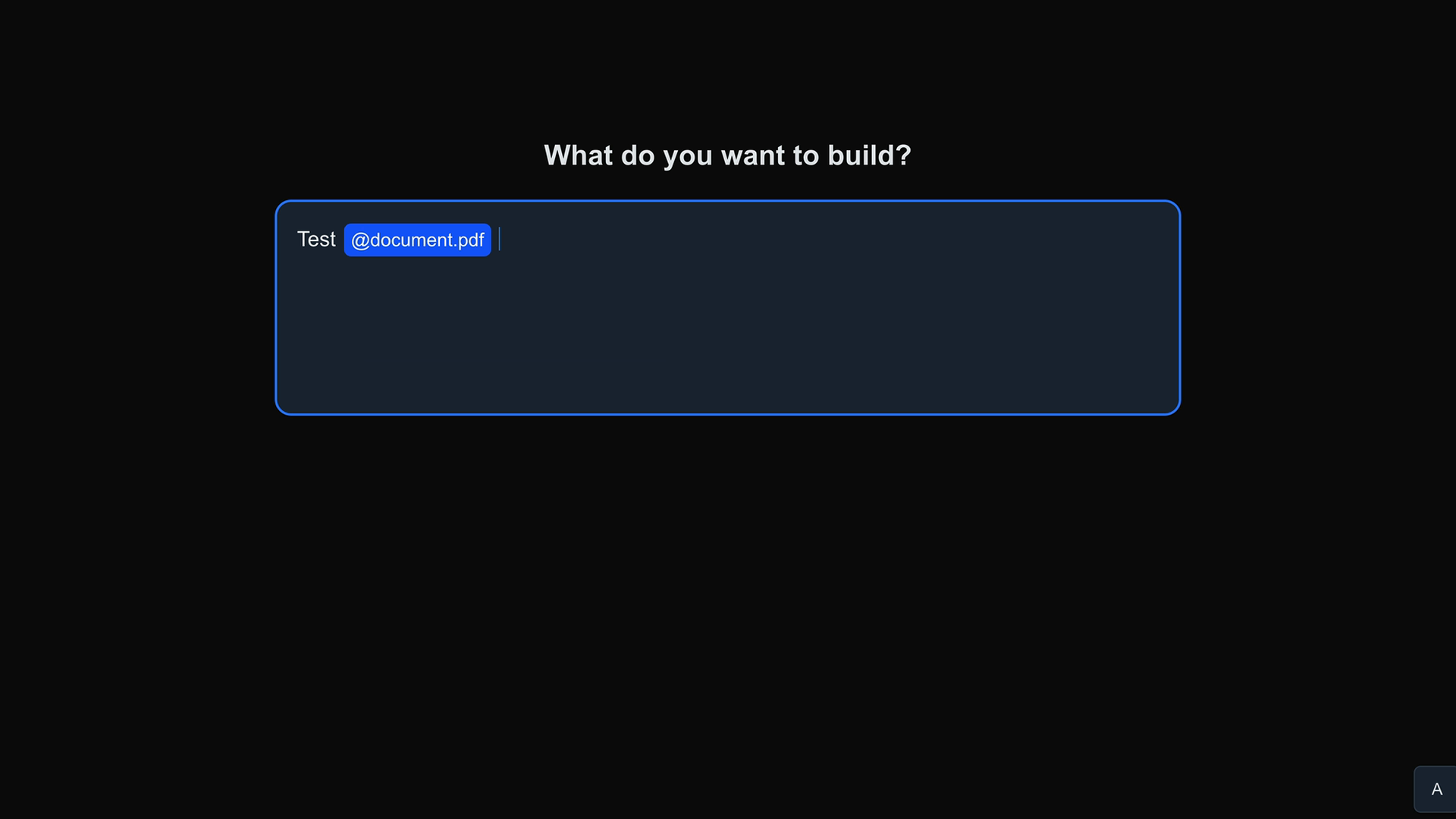 Text area headed "What do you want to build?" containing "Test" and a mention chip "@document.pdf" with the cursor after it.